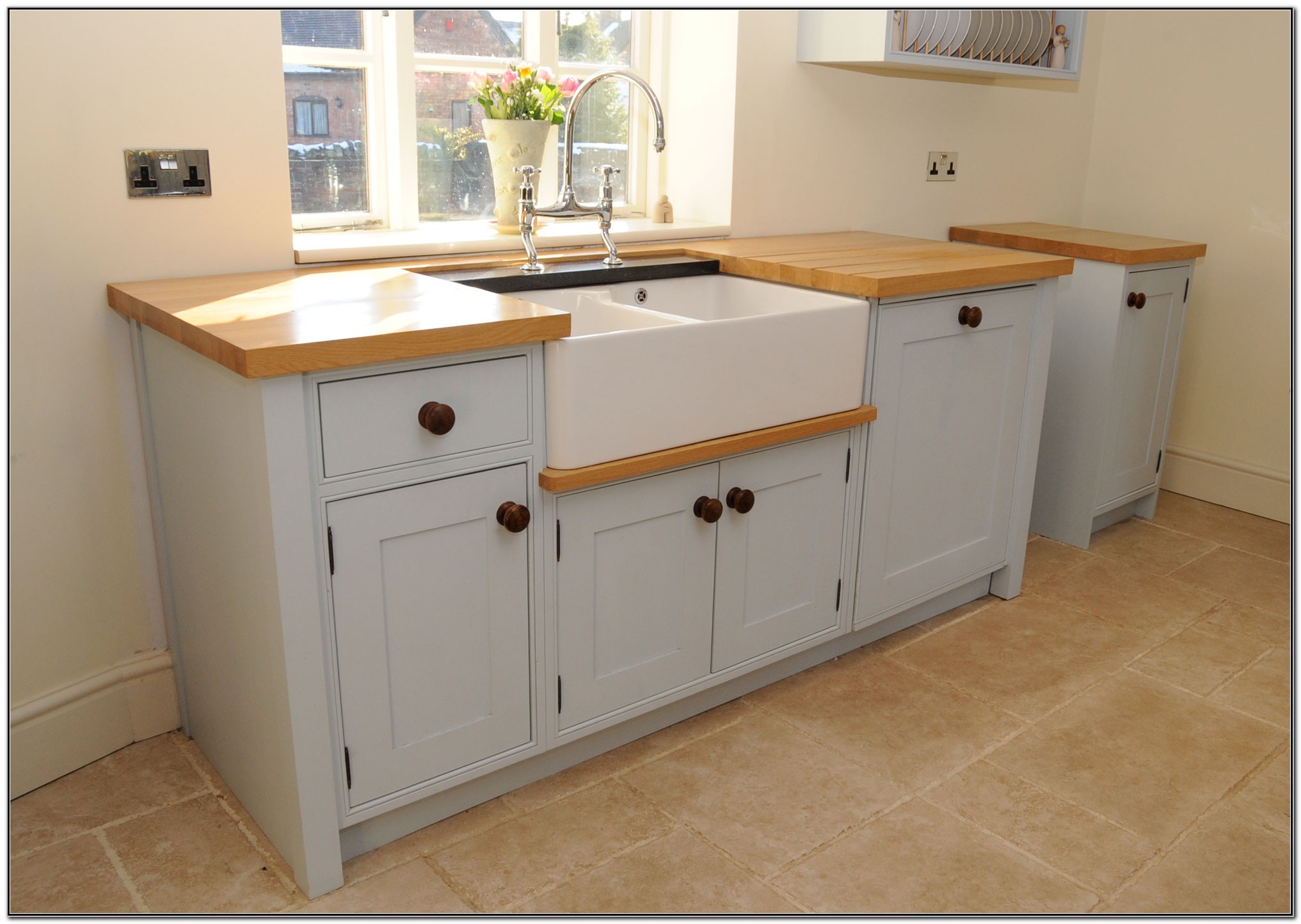 small kitchen sink in cabinet