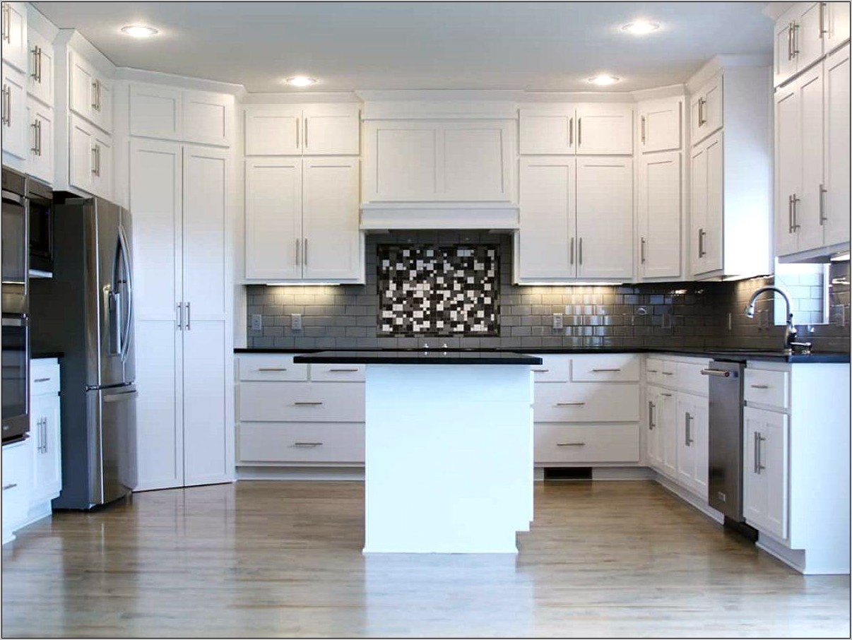 Antique White Cabinets With Black Countertops
